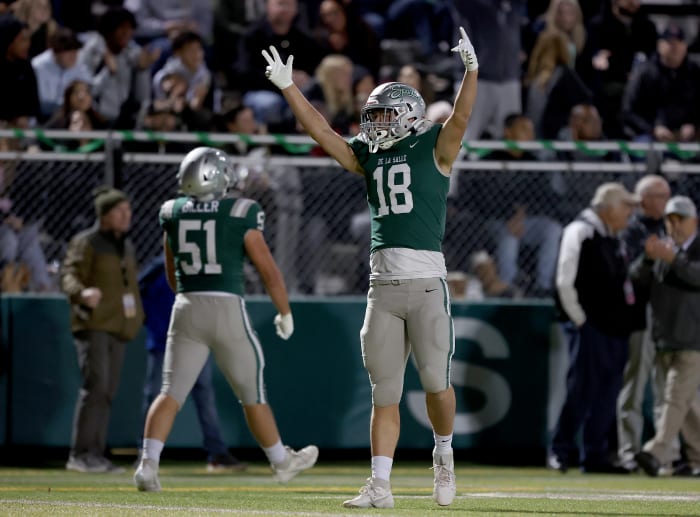 Drew Cunningham (18) and Chris Biller (51) celebrate 41-0 win over Clovis North in the CIF Division 1-AA championship game on Dec. 1.